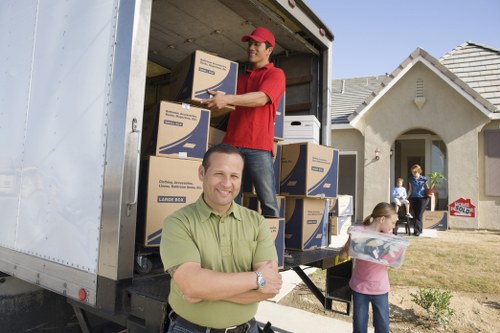 Removal team reviewing a customer complaint during a house move