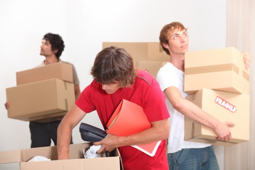 Movers handling a residential removal near a busy Ruislip street
