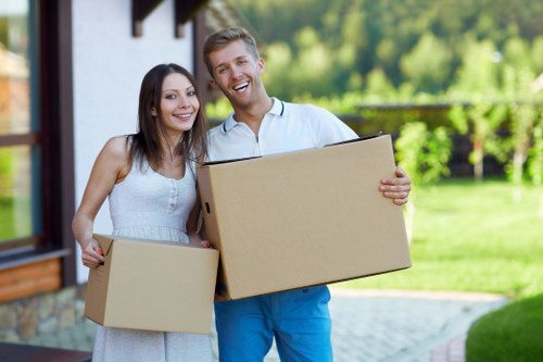Professional movers handling boxes and furniture during a Ruislip move