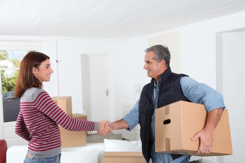 Furniture and boxes arranged for a measured cubic-yard removal estimate